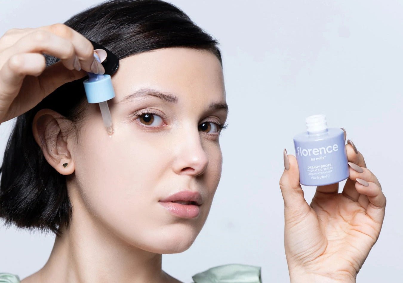 Millie Bobby Brown putting on face serum